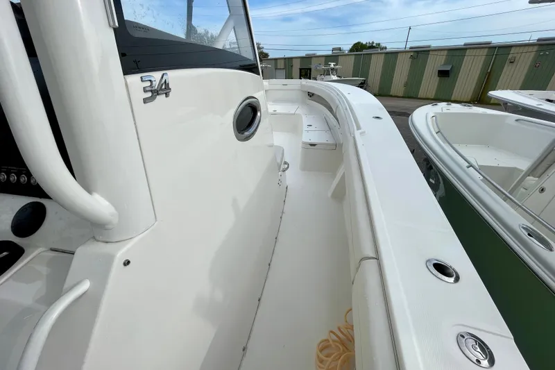 Slide: The Image of 2023 Regulator 34 boat deck, showcasing sleek design and spacious layout. - 25