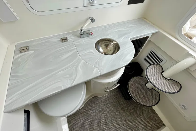 Slide: The Image of 2023 Regulator 34 boat interior with sleek countertop and compact sink design. - 27