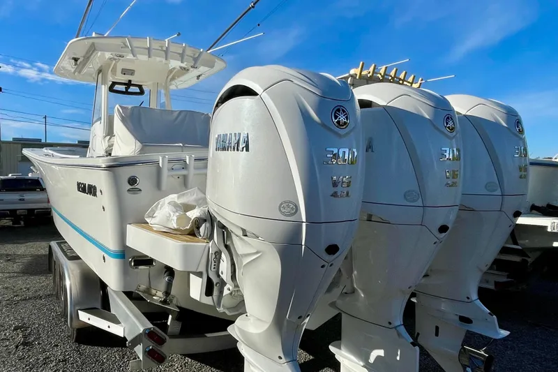 Slide: The Image of 2023 Regulator 34 boat with triple Yamaha 300 V6 outboard engines. - 3