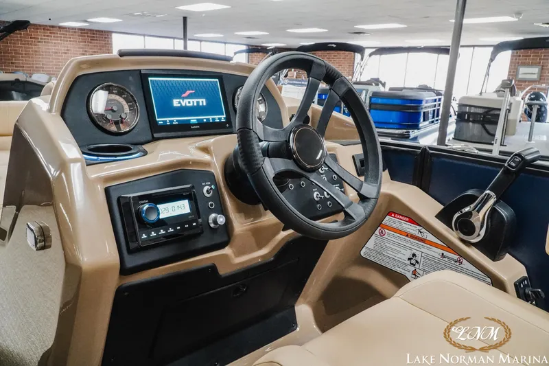 Slide: The Image of Interior of 2026 Evotti 523CS boat with modern dashboard and steering wheel. - 12