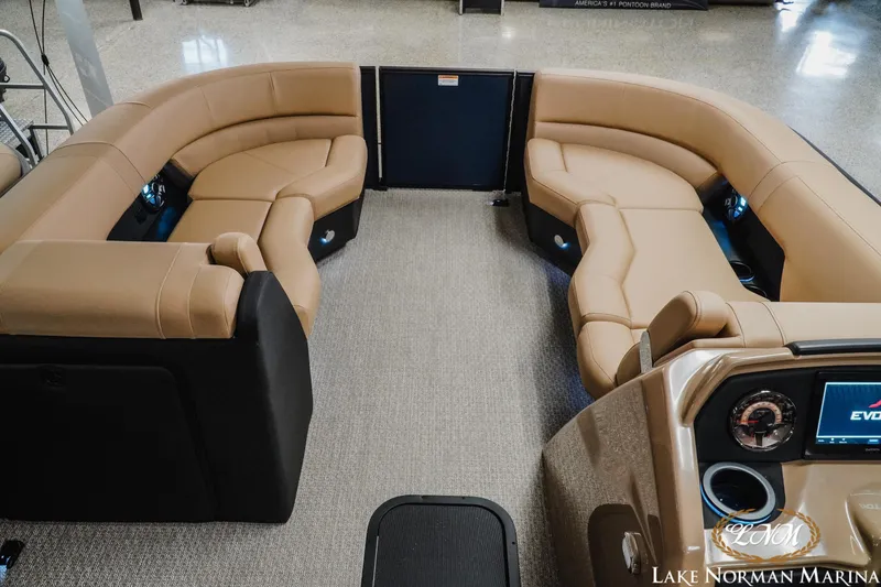 Slide: The Image of Luxurious interior of 2026 Evotti 523CS pontoon boat with tan seating at Lake Norman Marina. - 14