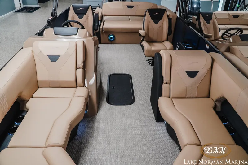 Slide: The Image of Luxurious interior of 2026 Evotti 523CS boat with beige seating at Lake Norman Marina. - 16