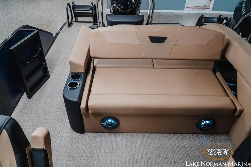 Slide: The Image of Luxurious interior of 2026 Evotti 523CS boat with tan seating and cup holders. - 20