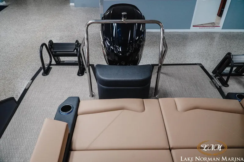Slide: The Image of 2026 Evotti 523CS boat interior with tan seating and sleek design at Lake Norman Marina. - 22