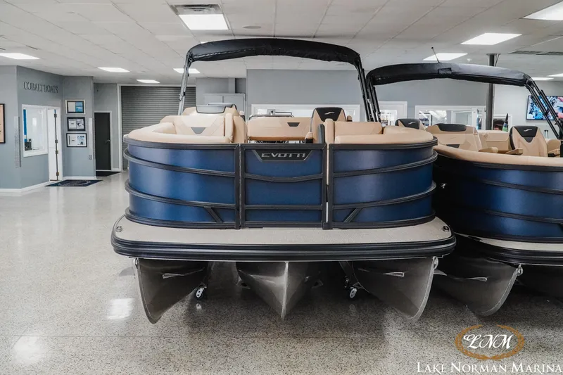 Slide: The Image of 2026 Evotti 523CS pontoon boat displayed at Lake Norman Marina showroom. - 5