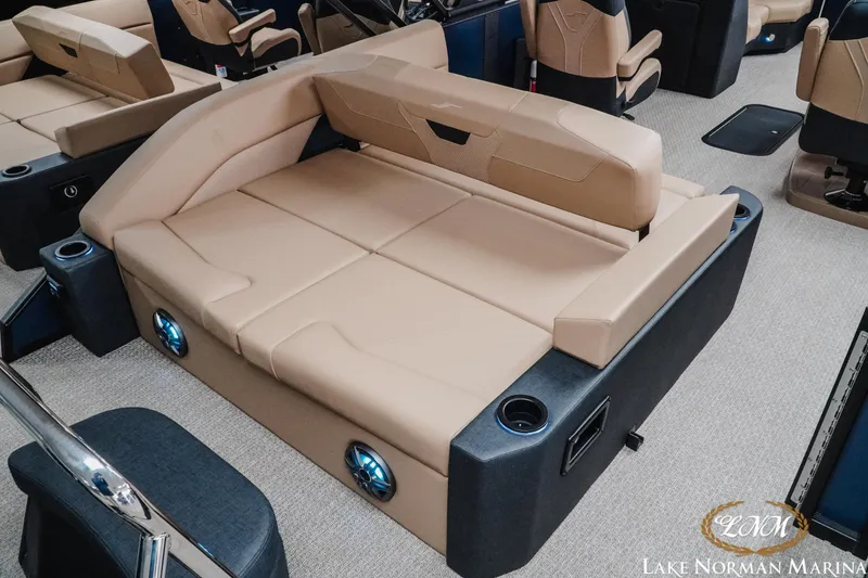 Slide: The Image of Luxurious seating in 2026 Evotti 523CS boat with beige upholstery and integrated speakers. - 7