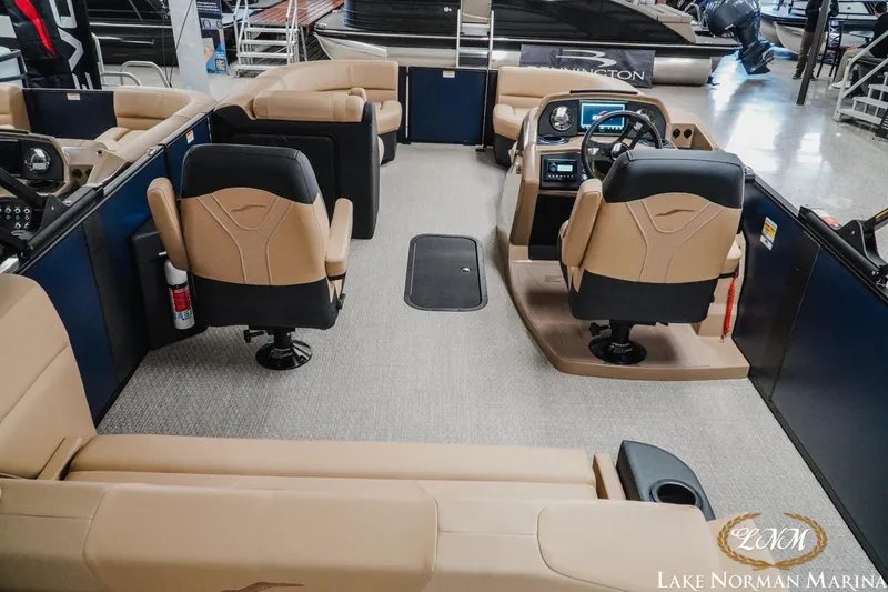 Slide: The Image of Interior of 2026 Evotti 523CS boat with beige seating and modern dashboard. - 8