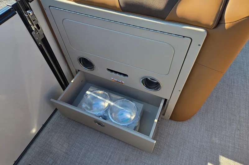 Slide: The Image of 2026 Avalon Platinum Catalina 2585 Elite boat interior with open storage drawer. - 10