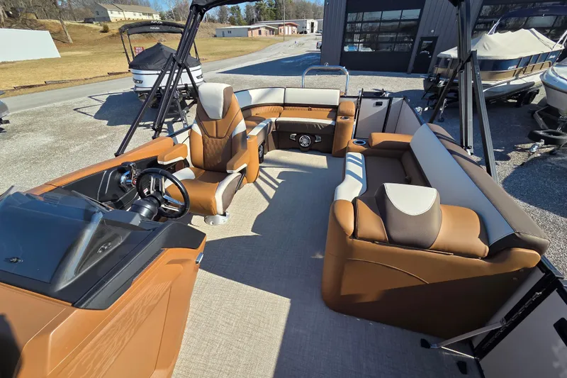 Slide: The Image of 2026 Avalon Platinum Catalina 2585 Elite pontoon boat interior with luxurious seating and modern dashboard. - 4
