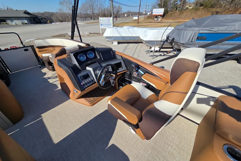 Slide: The Image of 2026 Avalon Platinum Catalina 2585 Elite boat interior with luxurious seating and modern dashboard. - 5
