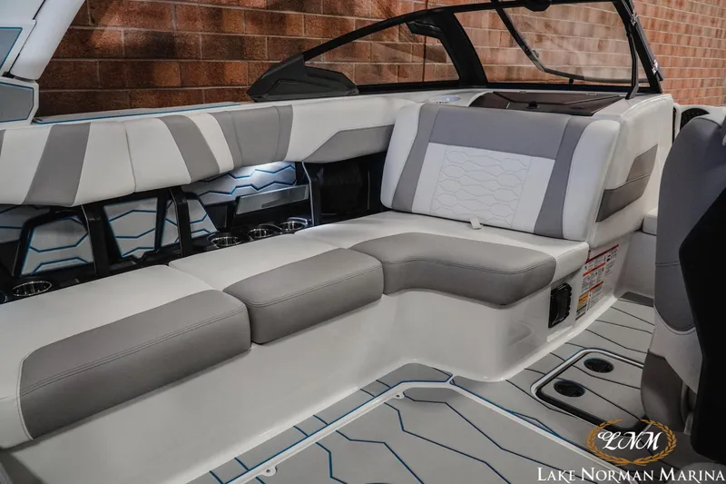 Slide: The Image of 2026 Malibu Wakesetter 22 MXZ interior with sleek, modern seating and stylish design. - 17