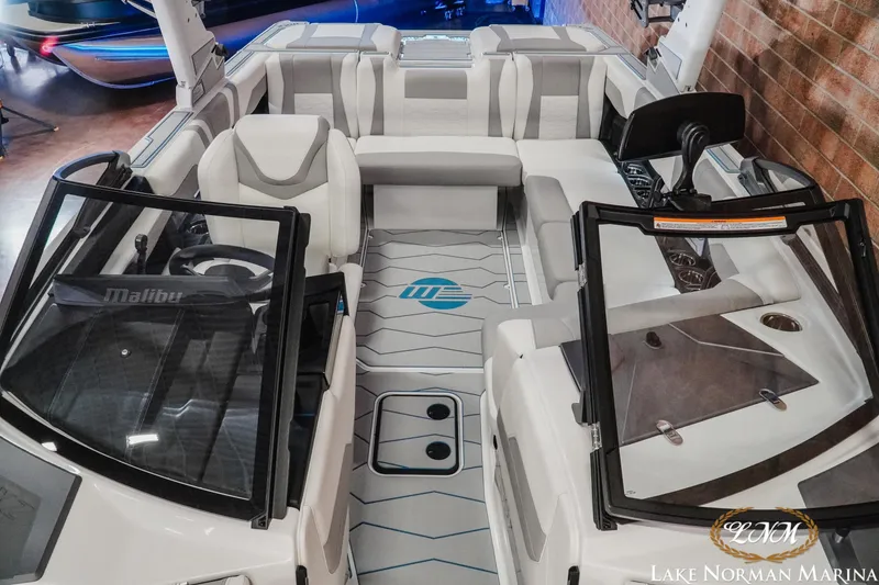 Slide: The Image of 2026 Malibu Wakesetter 22 MXZ interior with sleek seating and modern dashboard design. - 20