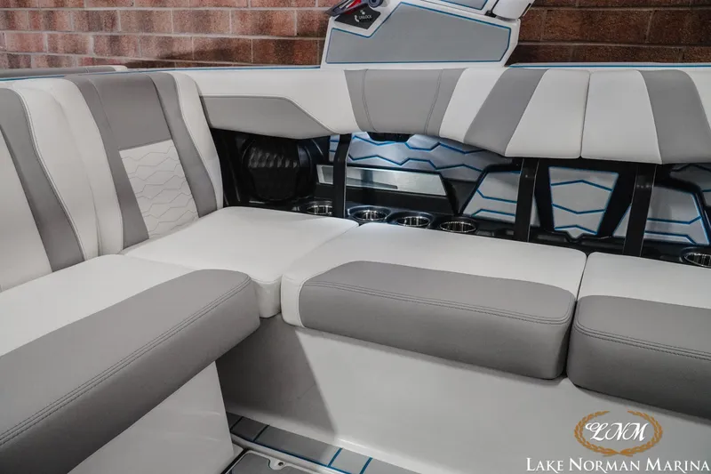 Slide: The Image of 2026 Malibu Wakesetter 22 MXZ interior with stylish gray and white seating. - 24
