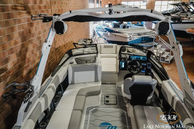 Slide: The Image of 2026 Malibu Wakesetter 22 MXZ interior at Lake Norman Marina, showcasing modern design and technology. - 26