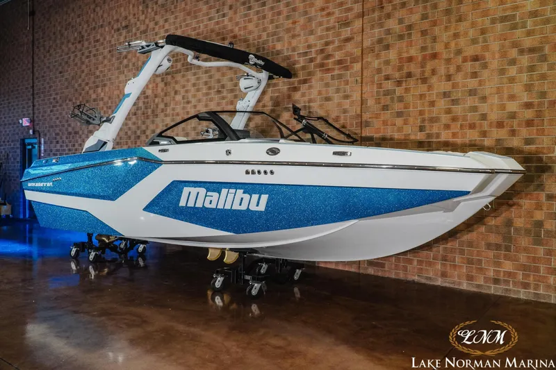 Slide: The Image of 2026 Malibu Wakesetter 22 MXZ boat displayed indoors at Lake Norman Marina. - 3