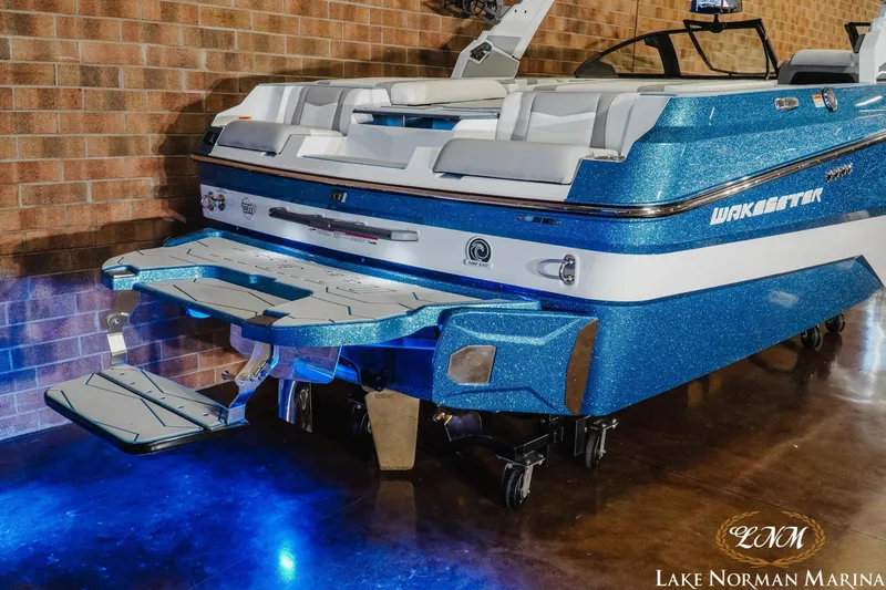 Slide: The Image of 2026 Malibu Wakesetter 22 MXZ boat with blue glitter finish at Lake Norman Marina. - 7