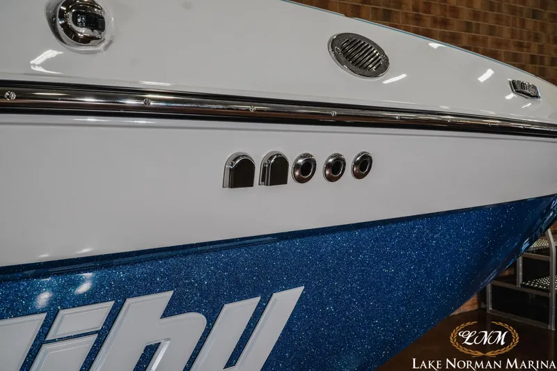 Slide: The Image of 2026 Malibu Wakesetter 22 MXZ boat with blue glitter finish at Lake Norman Marina. - 9