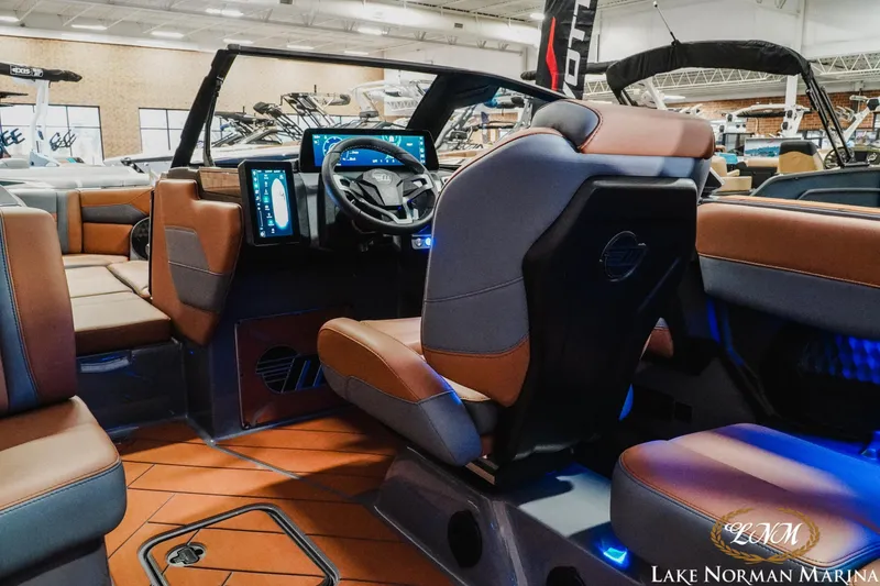 Slide: The Image of 2026 Malibu Wakesetter 23 LSV interior with modern dashboard and luxurious seating. - 18