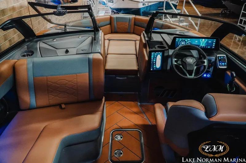 Slide: The Image of 2026 Malibu Wakesetter 23 LSV interior with modern dashboard and luxurious seating. - 19