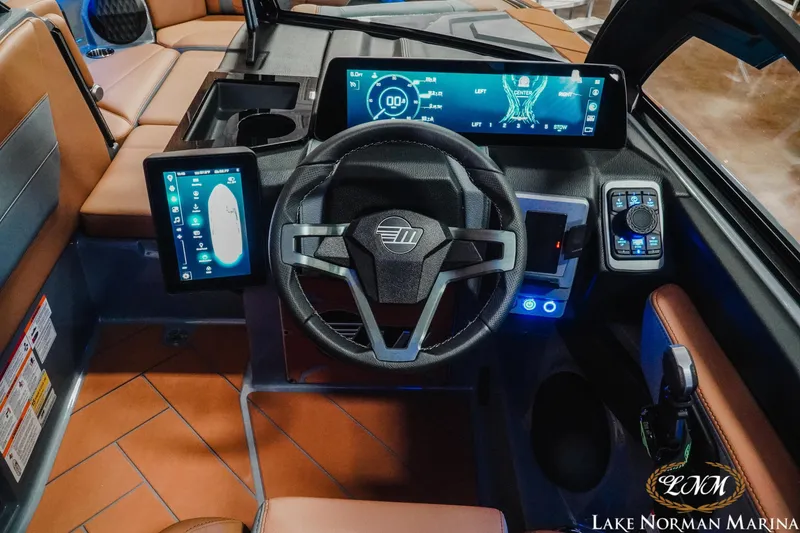 Slide: The Image of 2026 Malibu Wakesetter 23 LSV dashboard with advanced digital controls and luxurious seating. - 20