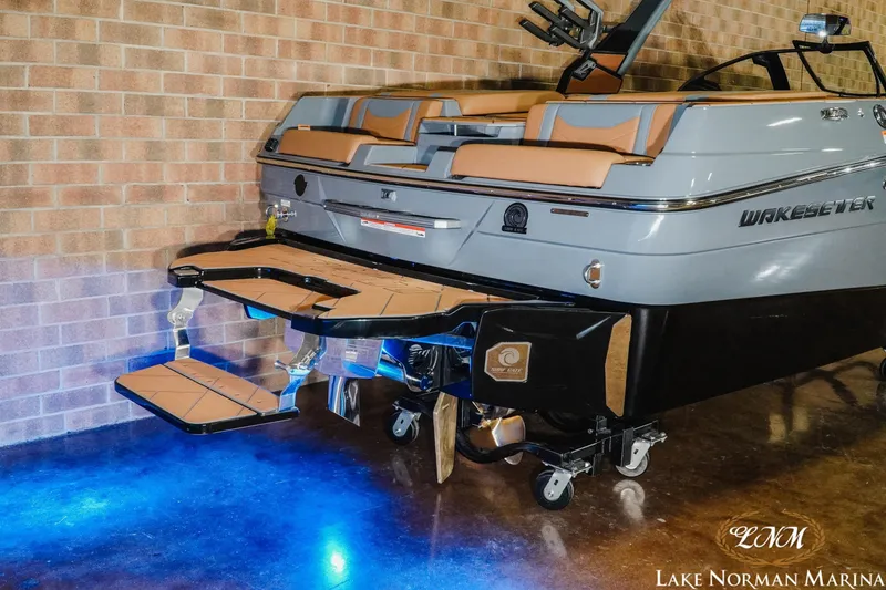 Slide: The Image of 2026 Malibu Wakesetter 23 LSV boat with illuminated swim platform at Lake Norman Marina. - 24
