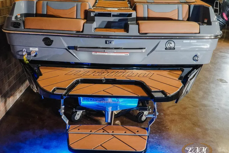 Slide: The Image of 2026 Malibu Wakesetter 23 LSV boat with illuminated swim platform and luxurious seating. - 25