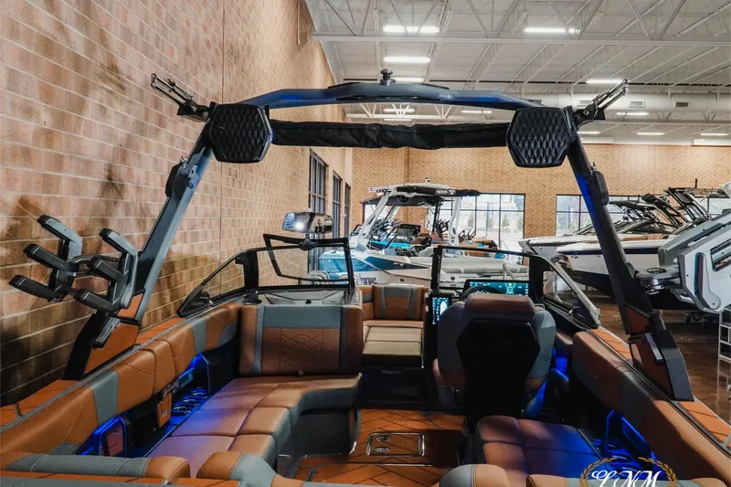 Slide: The Image of 2026 Malibu Wakesetter 23 LSV interior with modern design and advanced features in showroom. - 7