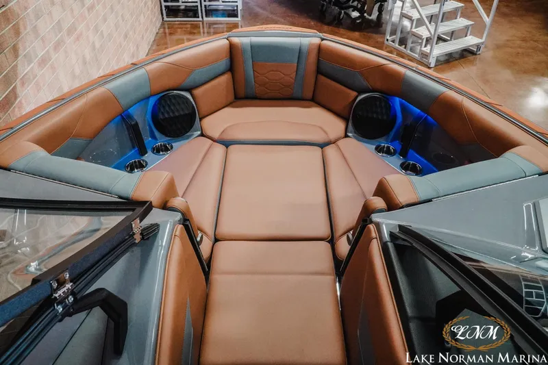 Slide: The Image of 2026 Malibu Wakesetter 23 LSV interior with luxurious seating and cup holders. - 8