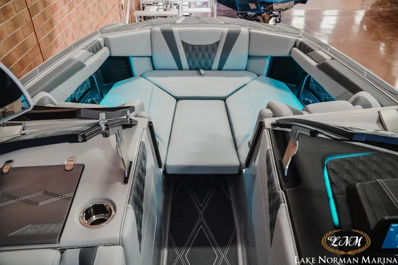 Slide: The Image of Luxurious interior of 2026 Malibu M230 boat with modern seating and ambient lighting. - 16