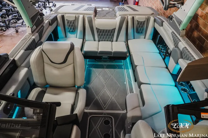 Slide: The Image of Luxurious interior of 2026 Malibu M230 boat with modern seating and ambient lighting. - 19