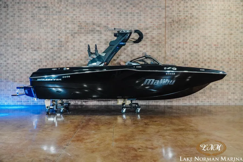The Image of 2026 Malibu Wakesetter 23 MXZ boat displayed indoors at Lake Norman Marina. - 1