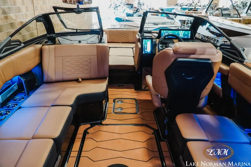 Slide: The Image of Luxurious interior of 2026 Malibu Wakesetter 23 MXZ boat with modern dashboard and seating. - 11
