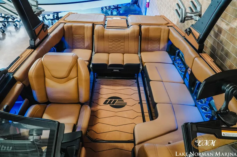 Slide: The Image of 2026 Malibu Wakesetter 23 MXZ interior with luxurious tan seating and modern design. - 18