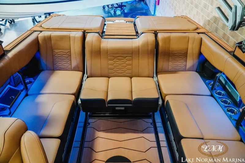 Slide: The Image of Luxurious interior of 2026 Malibu Wakesetter 23 MXZ with tan leather seating. - 19
