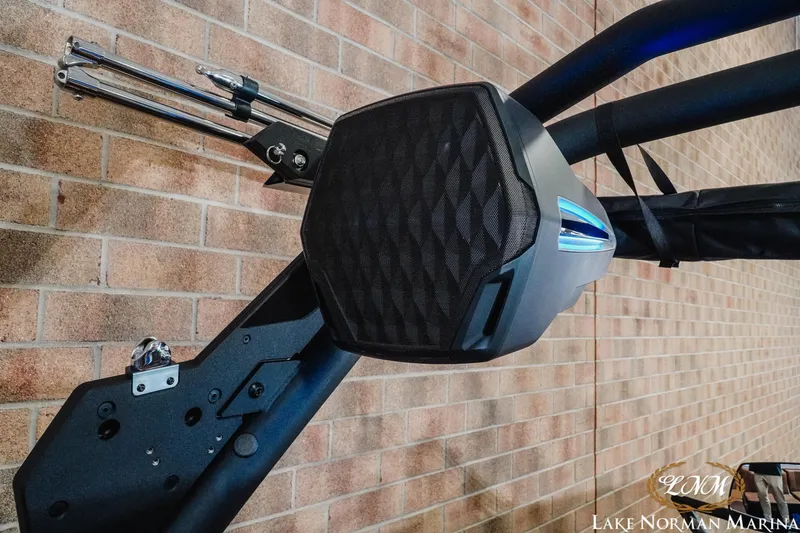 Slide: The Image of 2026 Malibu Wakesetter 23 MXZ speaker system against brick wall at Lake Norman Marina. - 20