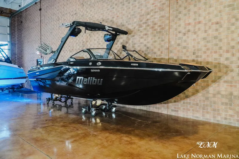 Slide: The Image of 2026 Malibu Wakesetter 23 MXZ boat displayed indoors at Lake Norman Marina. - 3