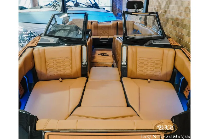 Slide: The Image of 2026 Malibu Wakesetter 23 MXZ interior with luxurious tan seating at Lake Norman Marina. - 6
