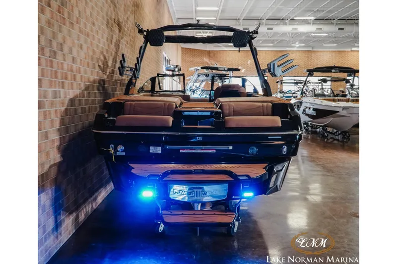 Slide: The Image of 2026 Malibu Wakesetter 23 MXZ boat with blue LED lights at Lake Norman Marina. - 8