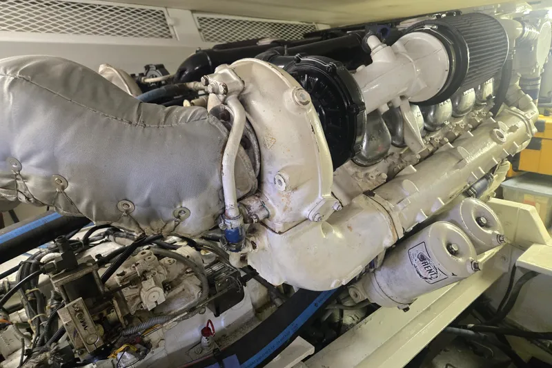 Slide: The Image of Engine of a 1990 Viking 53 Convertible yacht, showcasing detailed mechanical components. - 31