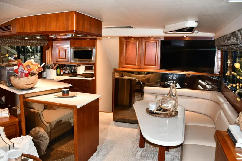 Slide: The Image of Luxurious interior of a 1990 Viking 53 Convertible yacht with modern amenities. - 8