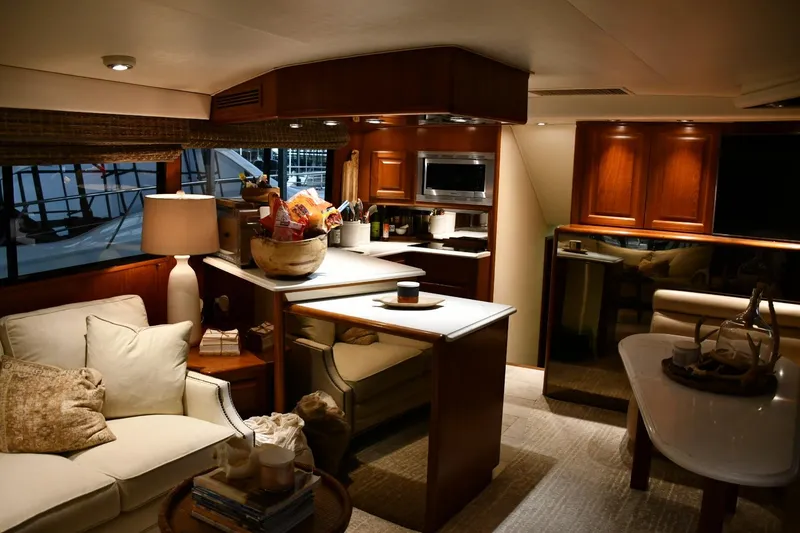 Slide: The Image of Luxurious interior of a 1990 Viking 53 Convertible yacht with elegant furnishings and warm lighting. - 9
