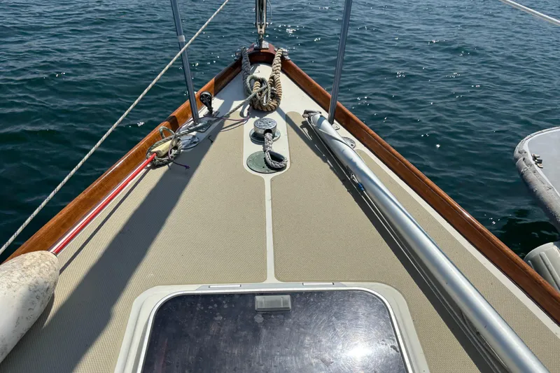 Slide: The Image of Deck view of 1998 Hank Hinckley Great Harbor 26 sailboat on water. - 12