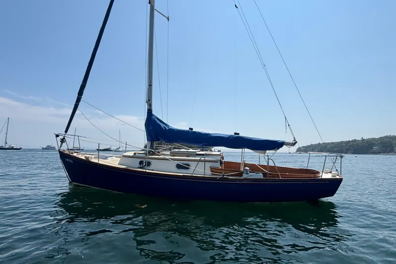 Slide: The Image of Sailboat on water, 1998 Hank Hinckley Great Harbor 26, blue hull, clear sky. - 29