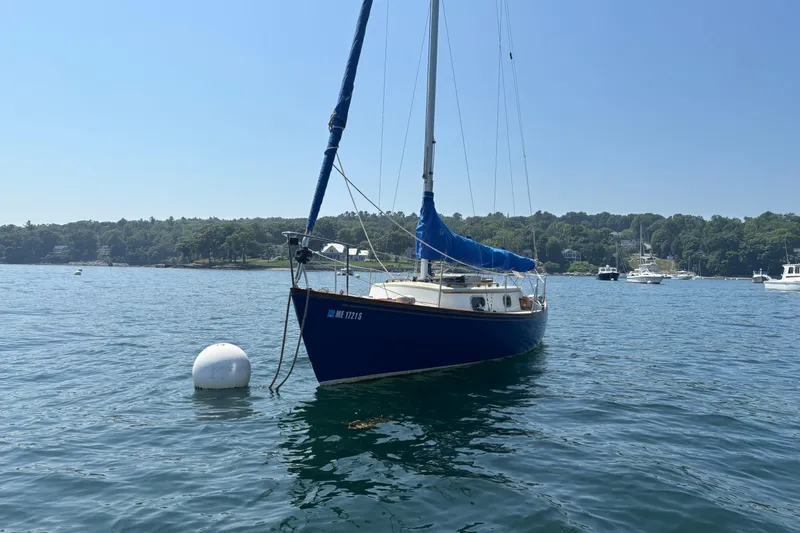 Slide: The Image of Sailboat "Hank Hinckley Great Harbor 26" from 1998 moored on calm water. - 30