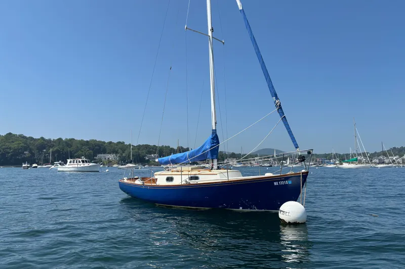 Slide: The Image of Sailboat "Hank Hinckley Great Harbor 26" from 1998 on calm water, clear sky. - 31