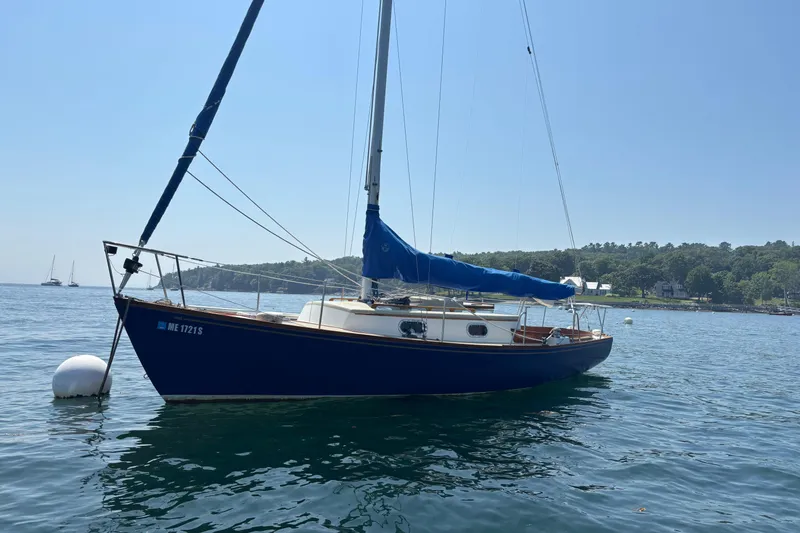 Slide: The Image of 1998 Hank Hinckley Great Harbor 26 sailboat anchored on calm water. - 5