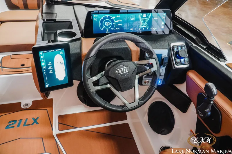 Slide: The Image of 2026 Malibu Wakesetter 21 LX dashboard with advanced digital displays and controls. - 15