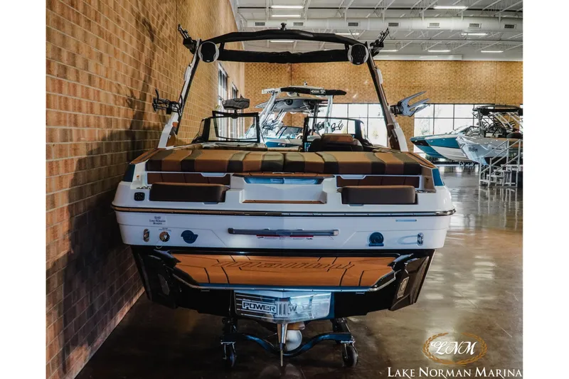Slide: The Image of 2026 Malibu Wakesetter 21 LX boat displayed indoors at Lake Norman Marina. - 8