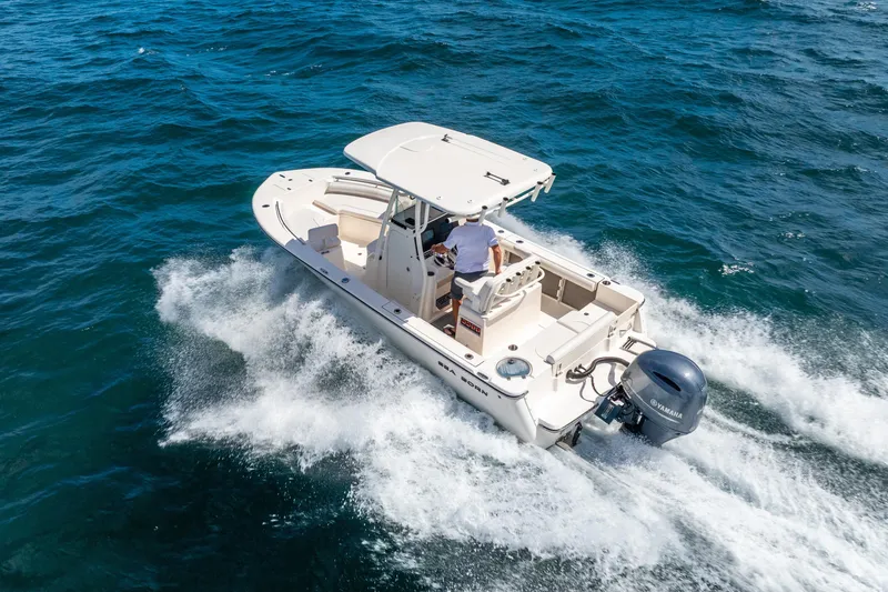 Slide: The Image of 2025 Sea Born LX22 Center Console boat cruising on open water. - 12