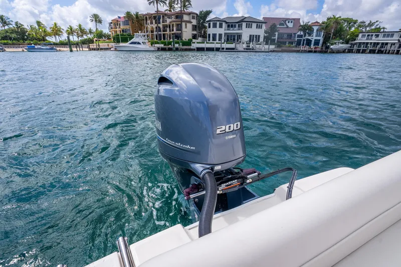Slide: The Image of 2025 Sea Born LX22 Center Console with Yamaha 200 engine on scenic waterfront. - 20